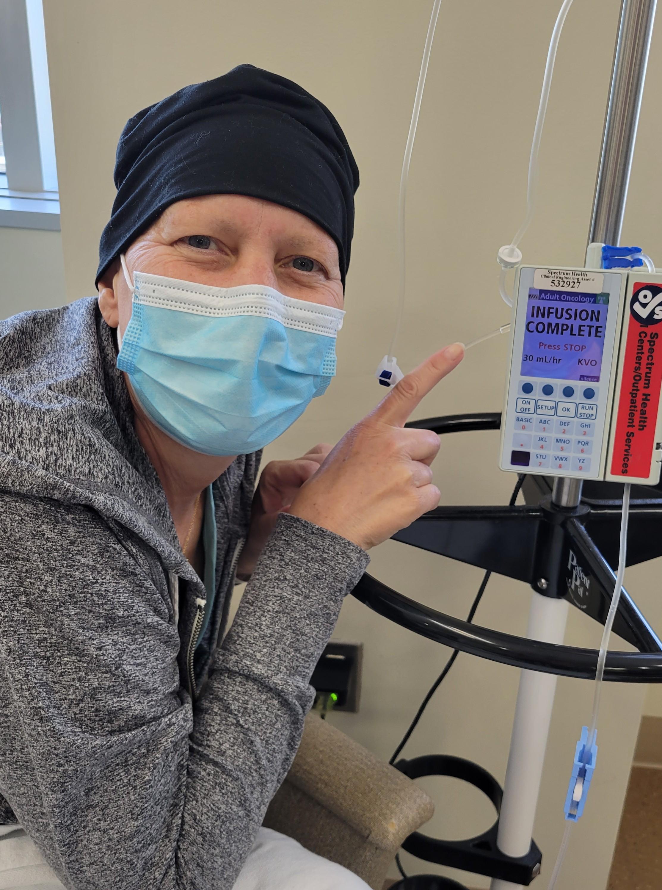 Amy Ritsema, co-owner of OnSite Wellness, takes a photo during her last round of chemotherapy